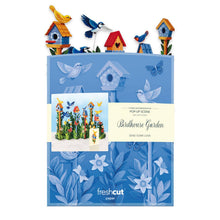 Load image into Gallery viewer, Packaging of 'Birdhouse Garden' card with colorful birdhouses and flowers on a blue background.