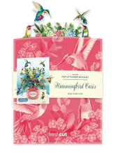 Load image into Gallery viewer, Packaging of 'Hummingbird Oasis' pop-up flower bouquet with pink background and hummingbird design.