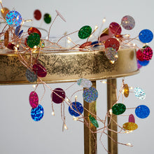 Load image into Gallery viewer, Decorative string lights with colorful beads on a gold stand against a light background