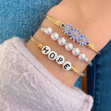 Load image into Gallery viewer, Luca+ Danni Cancer Awareness Daisy Bangle Bracelet - Petite/Silver Tone