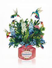 Load image into Gallery viewer, Fragrance bottle with floral design and hummingbird illustrations on a white background

