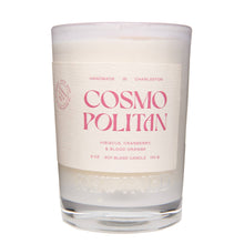 Load image into Gallery viewer, Candle with 'Cosmo Politan' text on a white background
