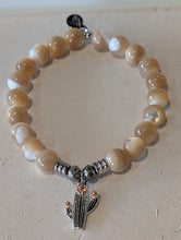 Load image into Gallery viewer, Tan Shell Gemstone Bracelet with Cactus Cutout Sterling Silver Charm
